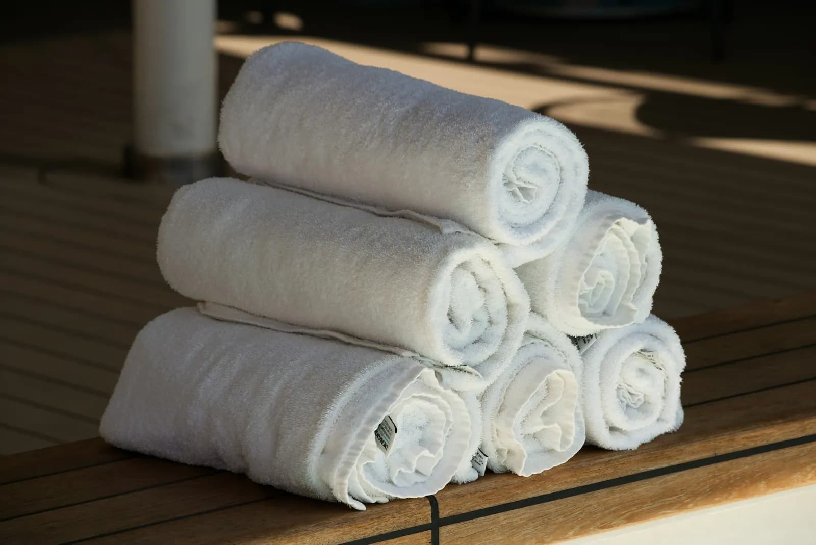 Stack of rolled white hotel towels