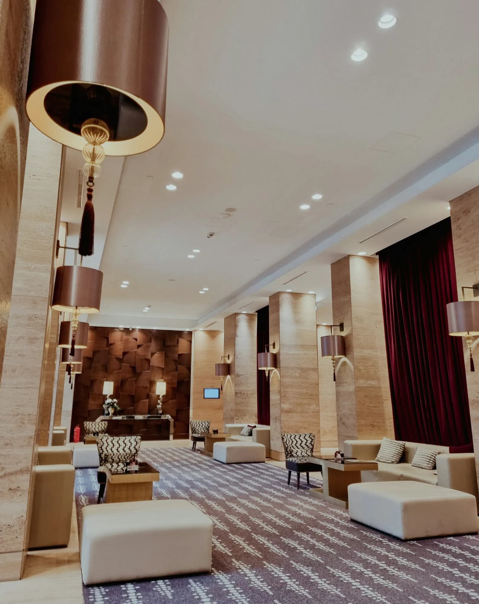 Hotel lobby with a chandelier and lounge seating