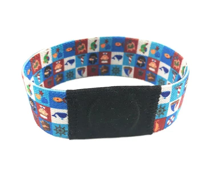 Patterned elastic fabric wristband with a chip pocket