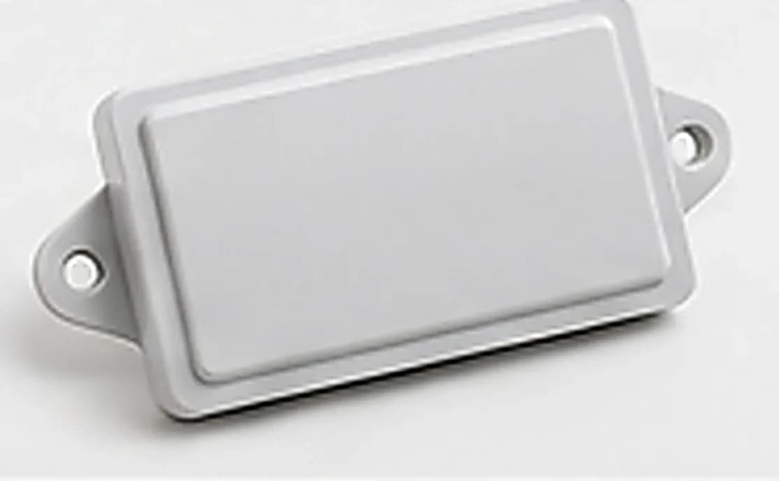 Gray active RFID tag with screw mounting lugs